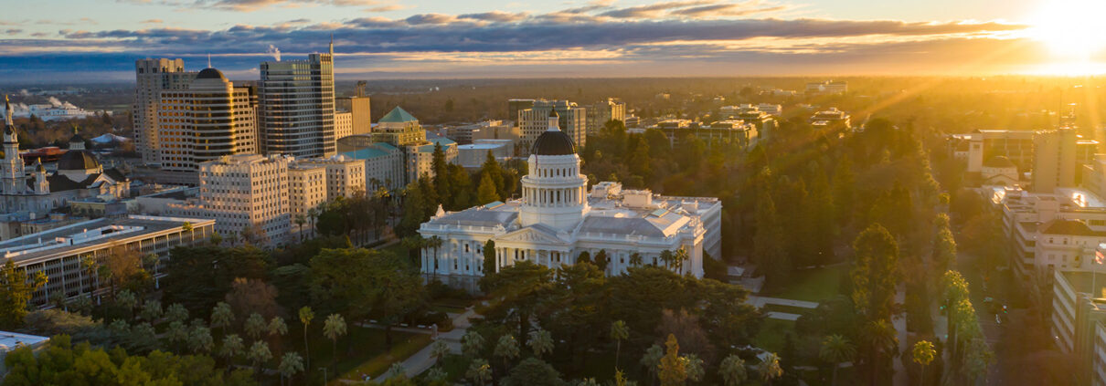 An aerial view of the Sacramento Capitol Building at sunrise