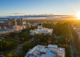 An aerial view of the Sacramento Capitol Building at sunrise