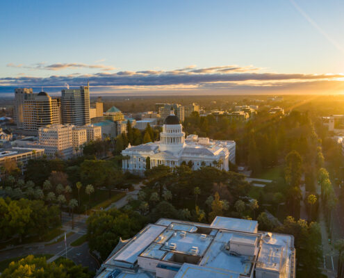 An aerial view of the Sacramento Capitol Building at sunrise